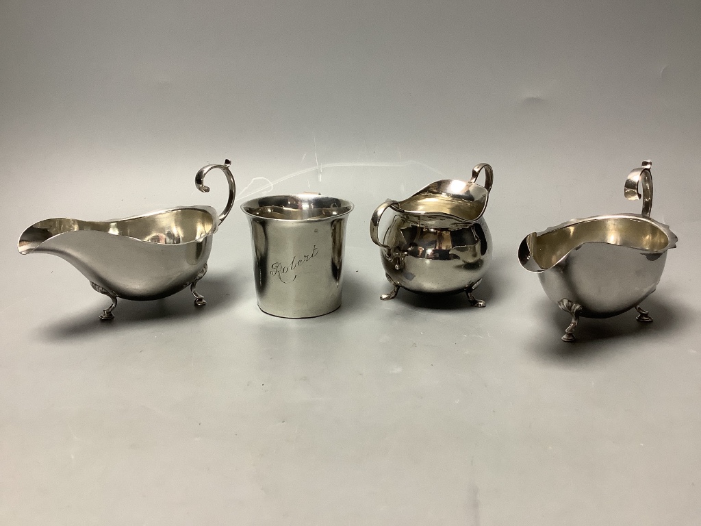 A Britannia silver Christening mug, Sheffield 1931, a pair of silver cream boats, Birmingham 1909 and a small silver sugar bowl approximately 14.6oz